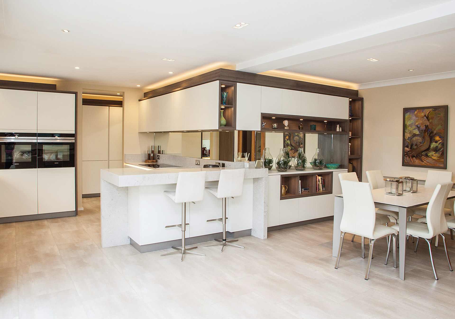 White lacquered Hacker kitchen, with dark pine accents, breakfast bar and Siemens appliances